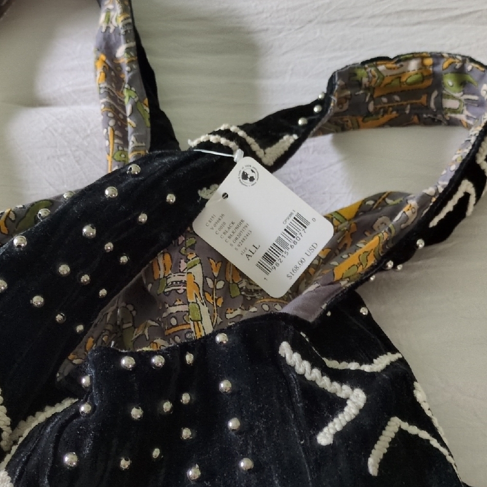 Free People Black and White Shoulder Bag with Decorative Studs.